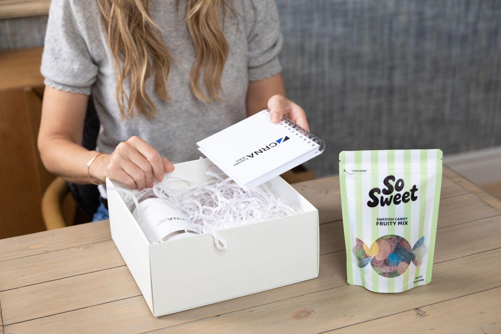 Emily packing a gift box